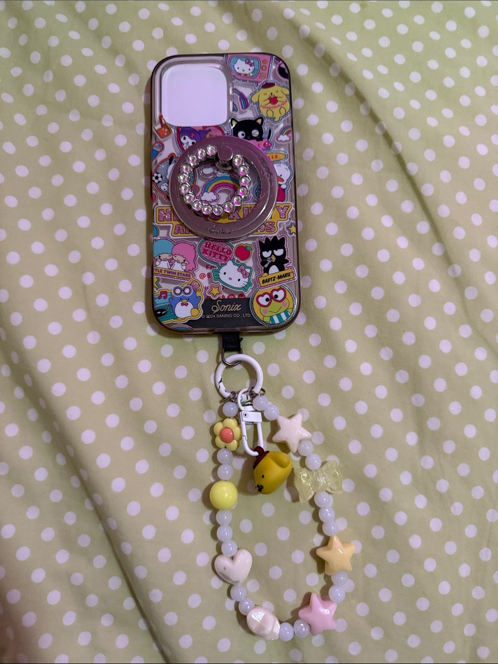 Sanrio Yellow & Pink Beaded Charm Phone Case with Rhinestone Ring. IPhone 16 pro